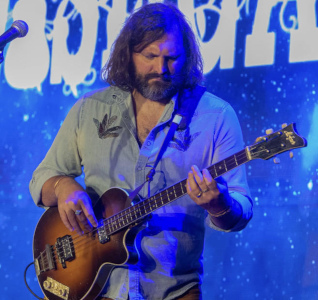 Wishgarden bass player Mark Tobik on stage.